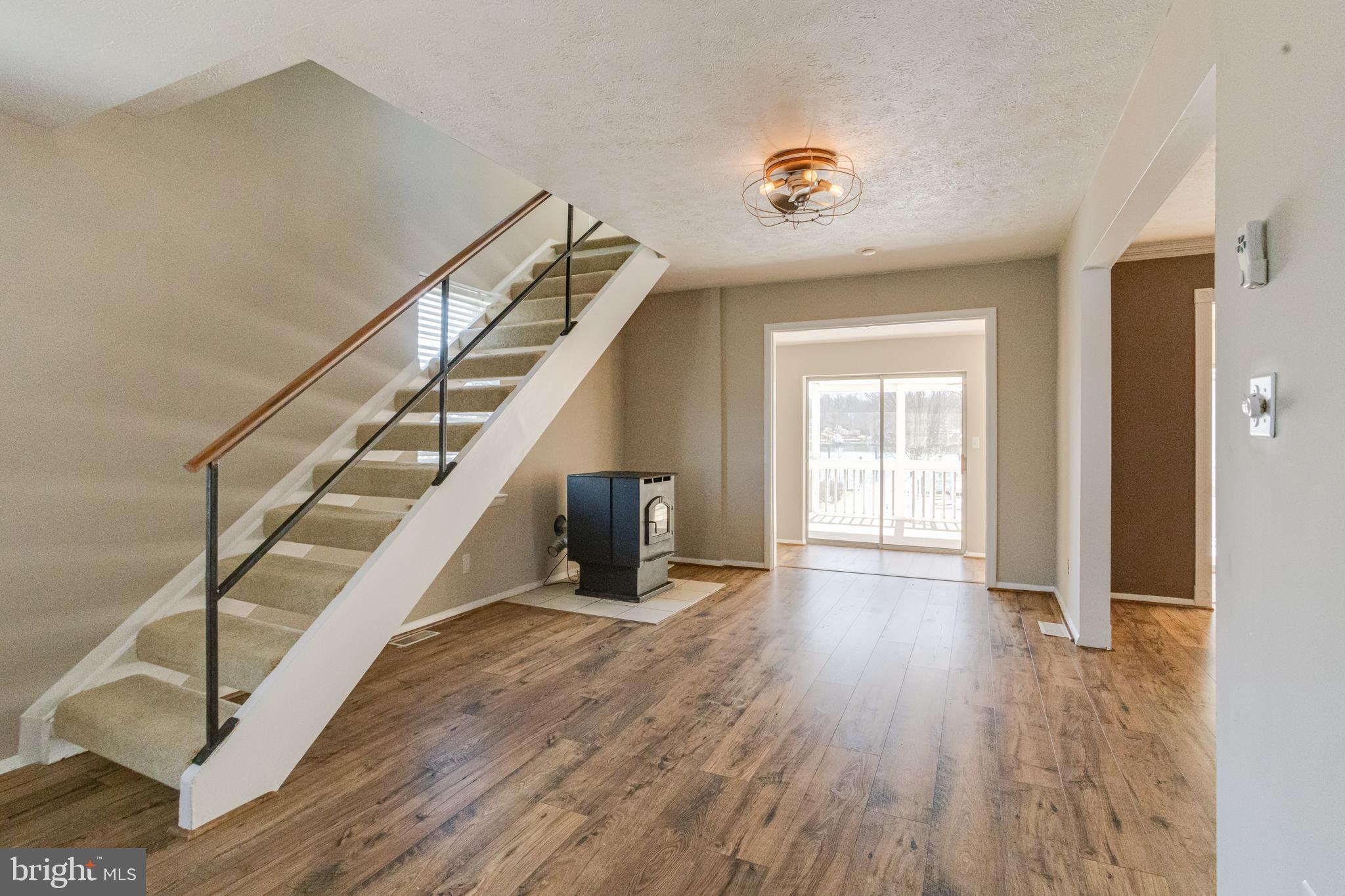 3809 Clarks Point Road Middle River, MD 21220 - Photo 14 of 49 a view of entryway and hall with wooden floor