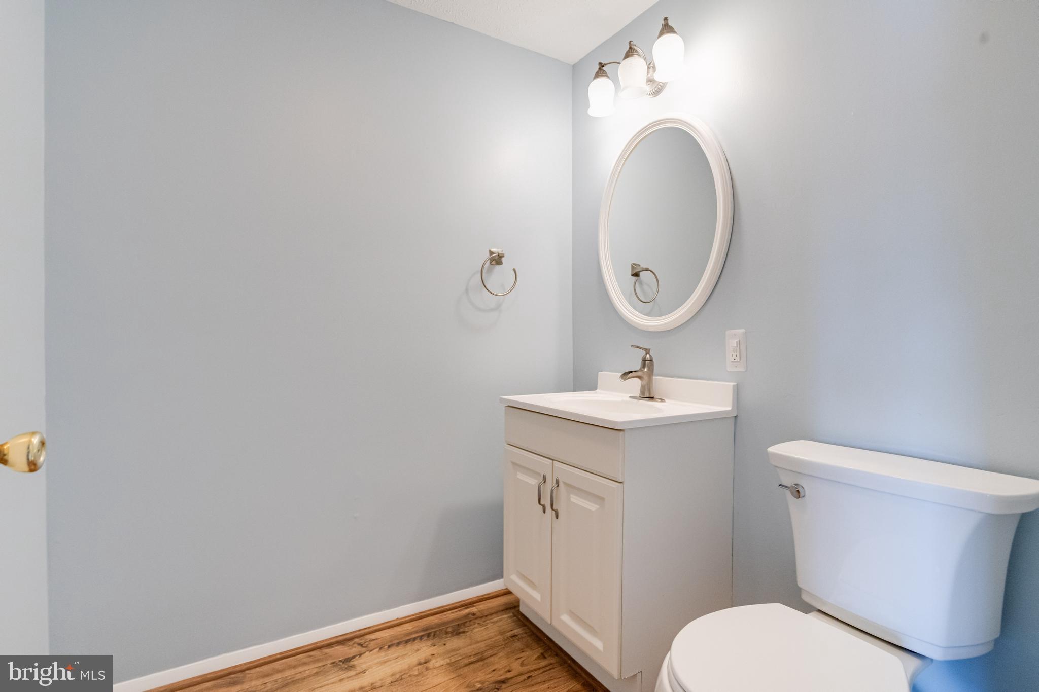 3809 Clarks Point Road Middle River, MD 21220 - Photo 21 of 49 a bathroom with a toilet a sink and mirror
