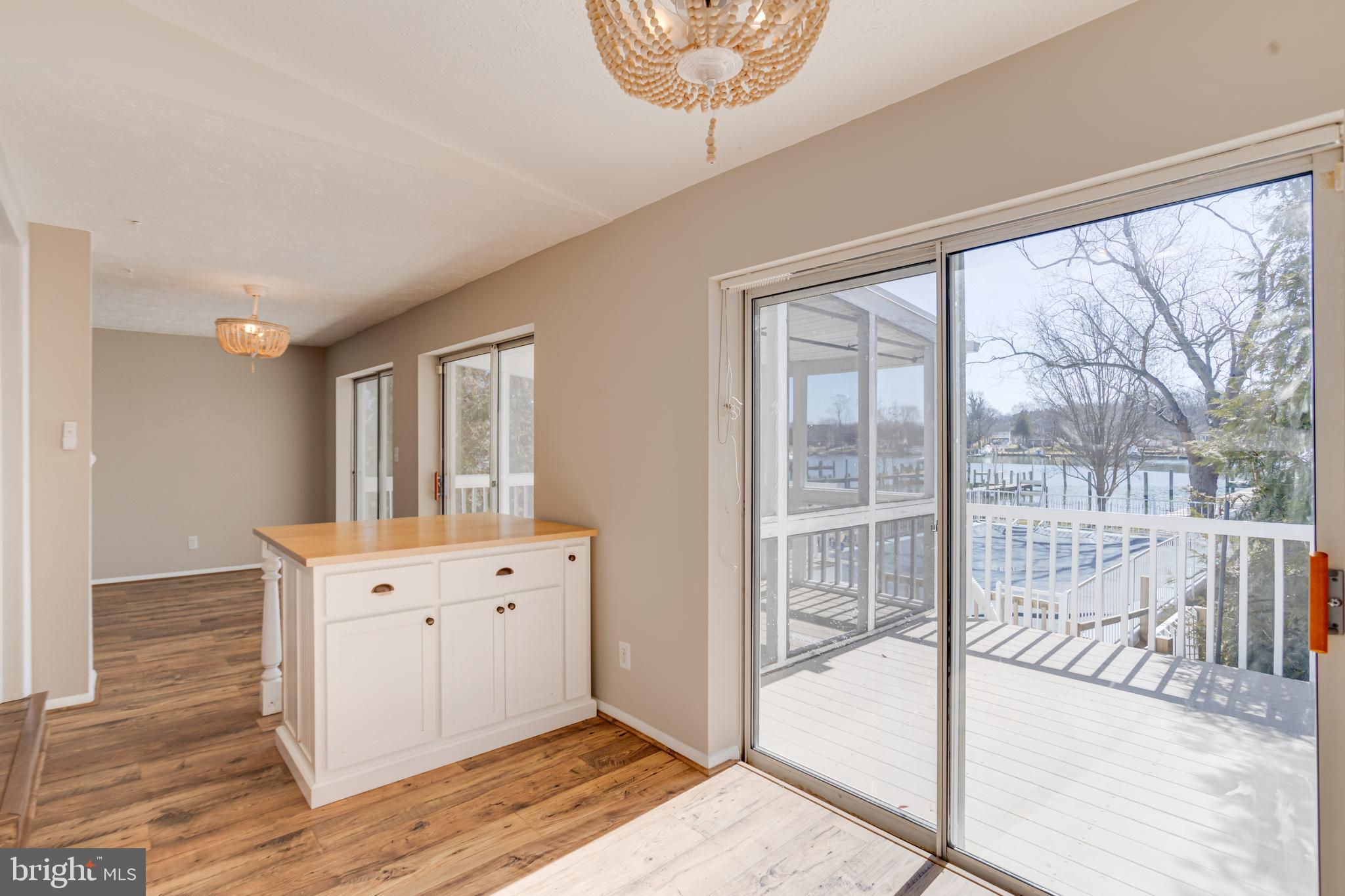 3809 Clarks Point Road Middle River, MD 21220 - Photo 27 of 49 a view of a big room with wooden floor and windows