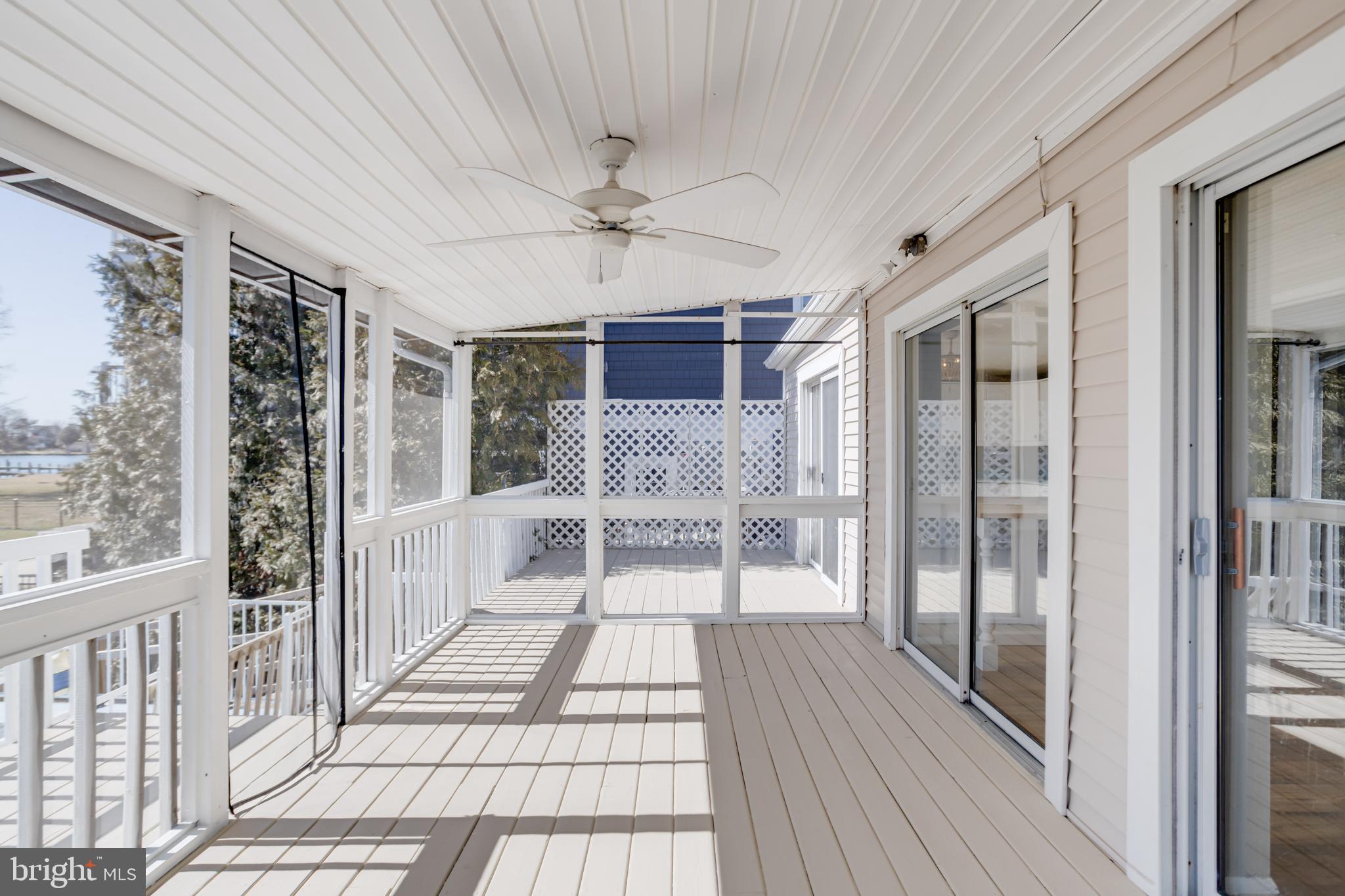 3809 Clarks Point Road Middle River, MD 21220 - Photo 29 of 49 a view of a hallway with wooden floor and chandelier