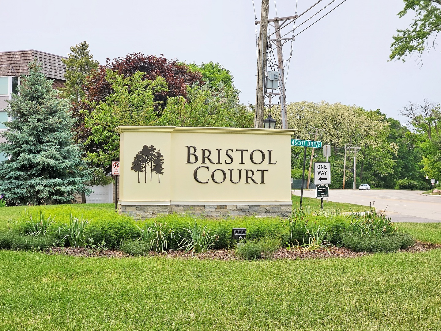 500 Thames Parkway, Unit 2K Park Ridge, IL 60068 - Photo 1 of 18 a sign of golf club on a wall under a tree