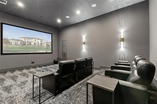 a bathroom with granite countertop a sink and a white wooden cabinets