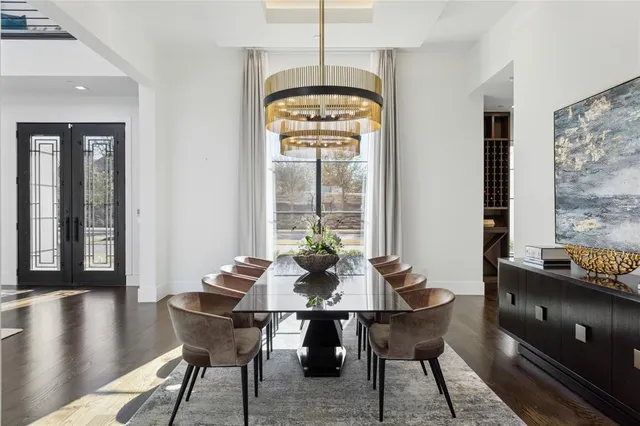 a dining room with furniture window and wooden floor