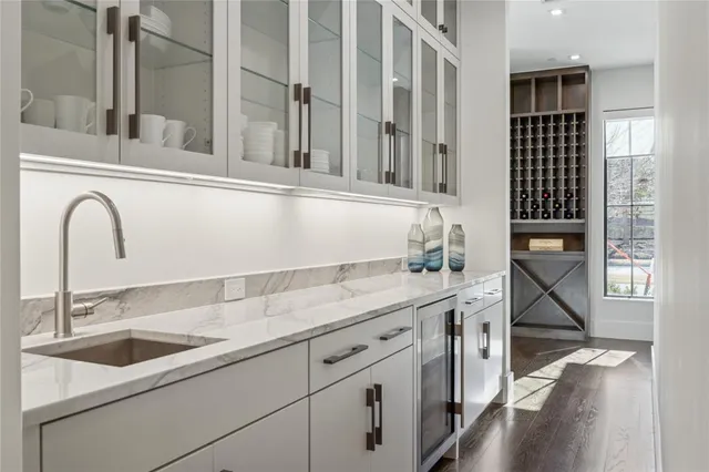 a kitchen with a sink and cabinets