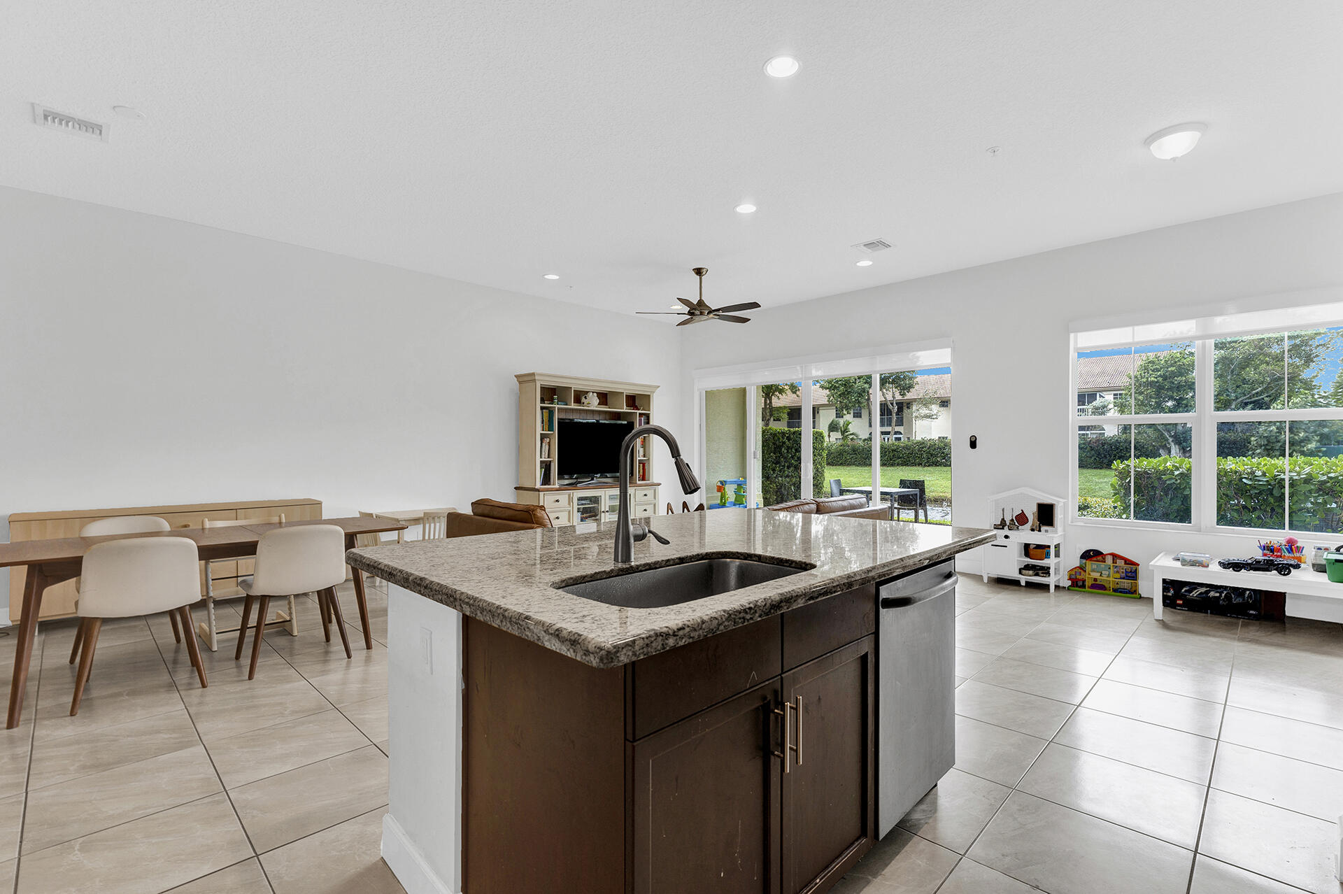 6640 Quiet Wave Trail, Unit 67 Boca Raton, FL 33433 - Photo 12 of 35 a kitchen with a sink and large window