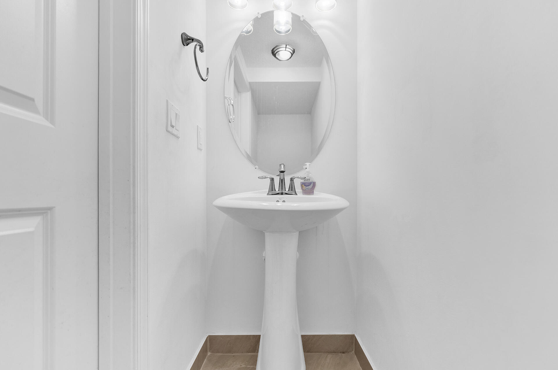 6640 Quiet Wave Trail, Unit 67 Boca Raton, FL 33433 - Photo 13 of 35 a bathroom with a sink and a mirror