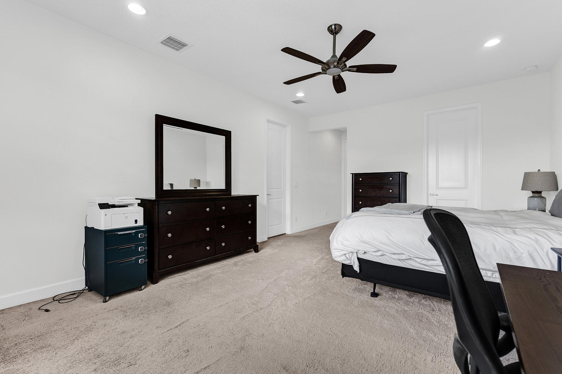 6640 Quiet Wave Trail, Unit 67 Boca Raton, FL 33433 - Photo 15 of 35 a bedroom with a bed and a dresser