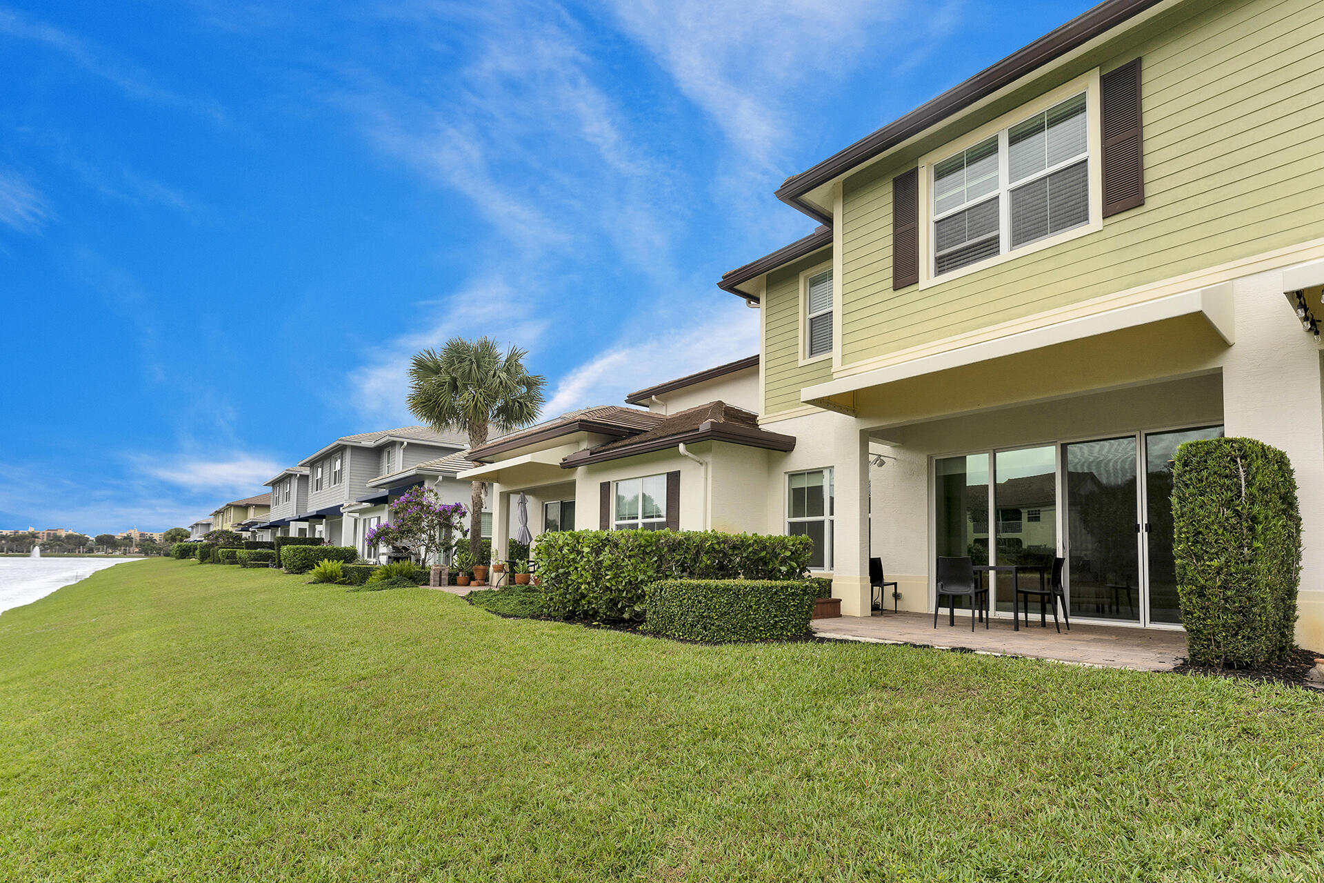 6640 Quiet Wave Trail, Unit 67 Boca Raton, FL 33433 - Photo 24 of 35 a front view of a house with a yard