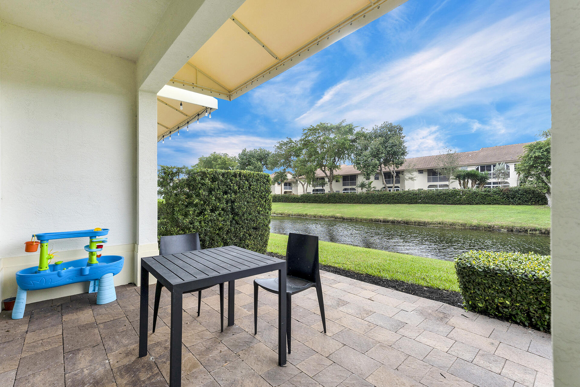 6640 Quiet Wave Trail, Unit 67 Boca Raton, FL 33433 - Photo 26 of 35 a balcony with furniture and lake view