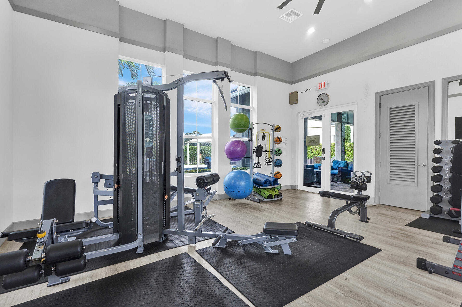 6640 Quiet Wave Trail, Unit 67 Boca Raton, FL 33433 - Photo 34 of 35 a room with gym equipment and a large window