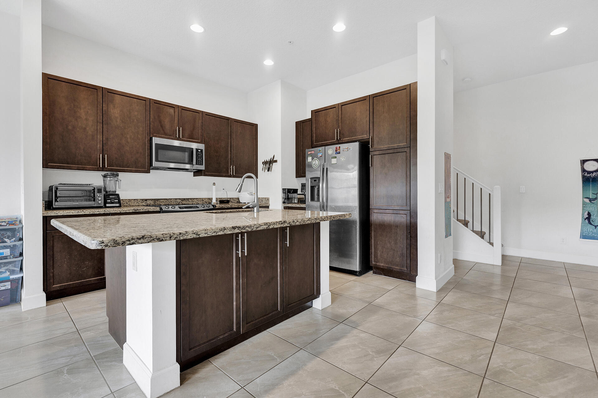 6640 Quiet Wave Trail, Unit 67 Boca Raton, FL 33433 - Photo 5 of 35 a kitchen with stainless steel appliances granite countertop a refrigerator oven a sink and dishwasher