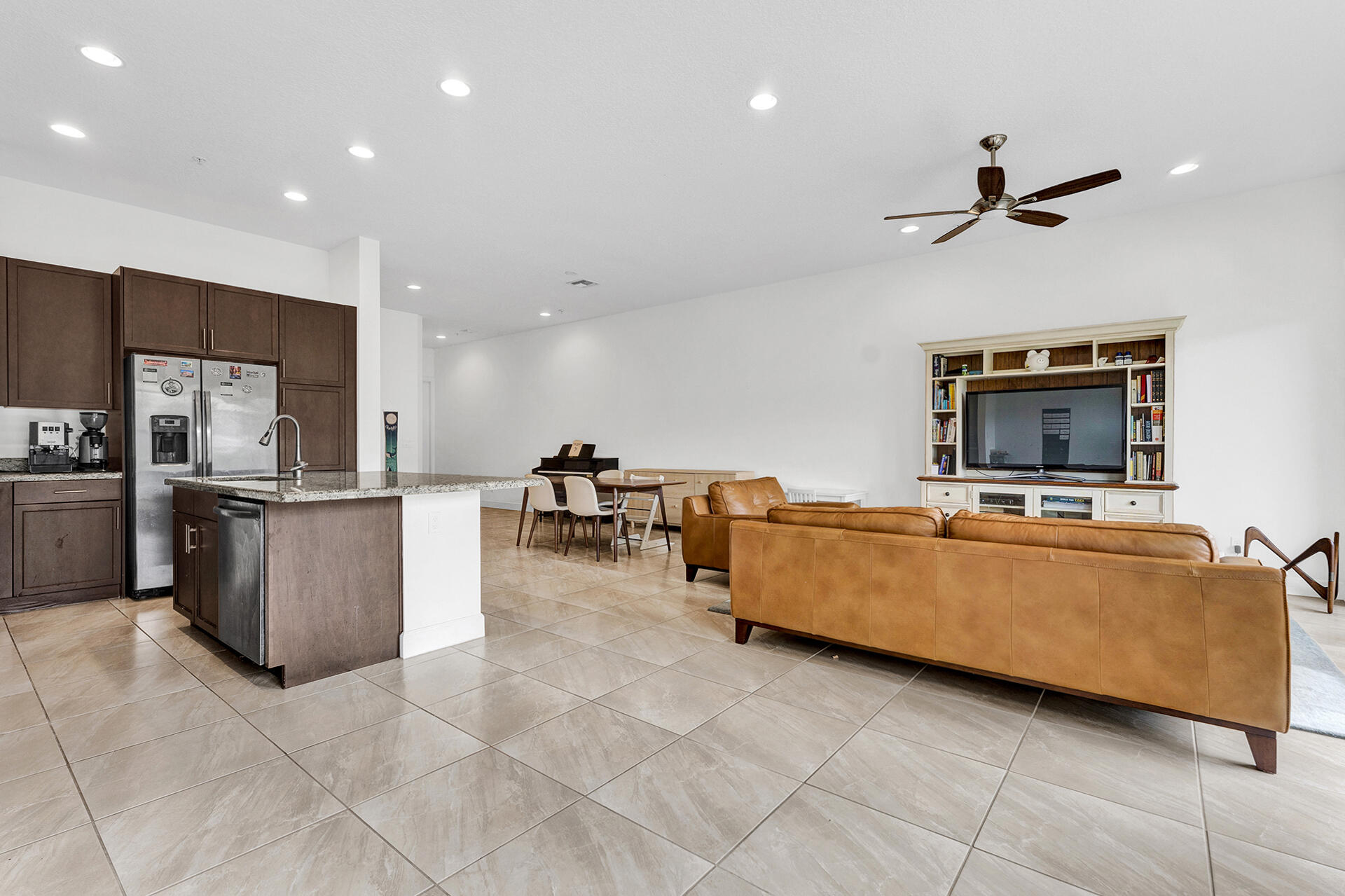 6640 Quiet Wave Trail, Unit 67 Boca Raton, FL 33433 - Photo 8 of 35 a living room with furniture and a flat screen tv