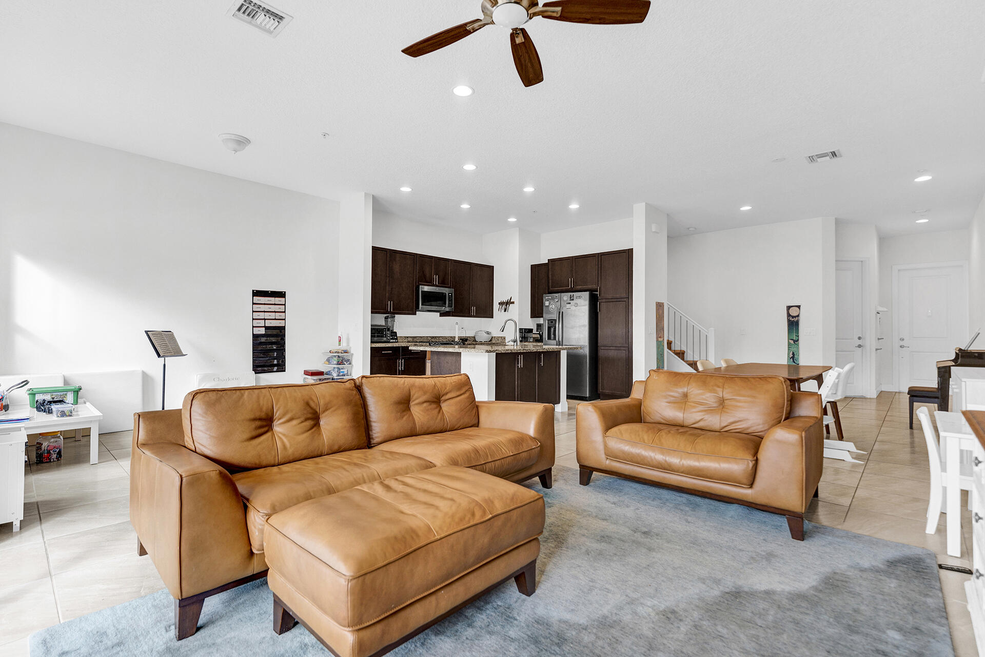 6640 Quiet Wave Trail, Unit 67 Boca Raton, FL 33433 - Photo 9 of 35 a living room with furniture and kitchen view