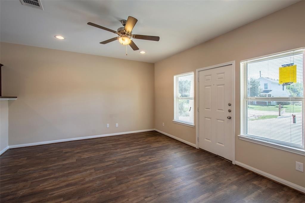 8142 Cabot Street, Unit A Houston, TX 77078 - Photo 10 of 21 wooden floor in an empty room with a window