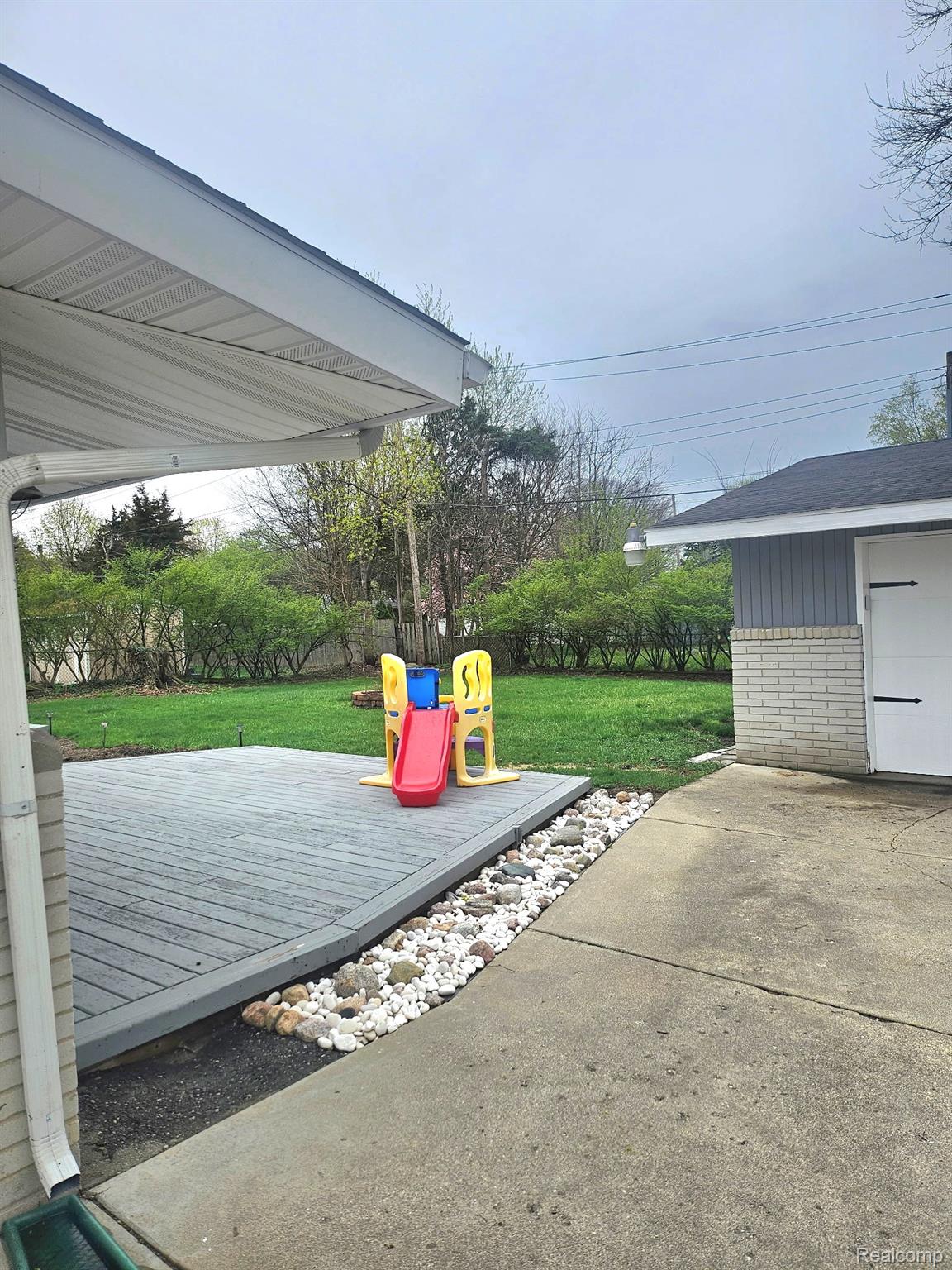 2121 South Commerce Road Walled Lake, MI 48390 - Photo 2 of 13 View of patio featuring a wooden deck