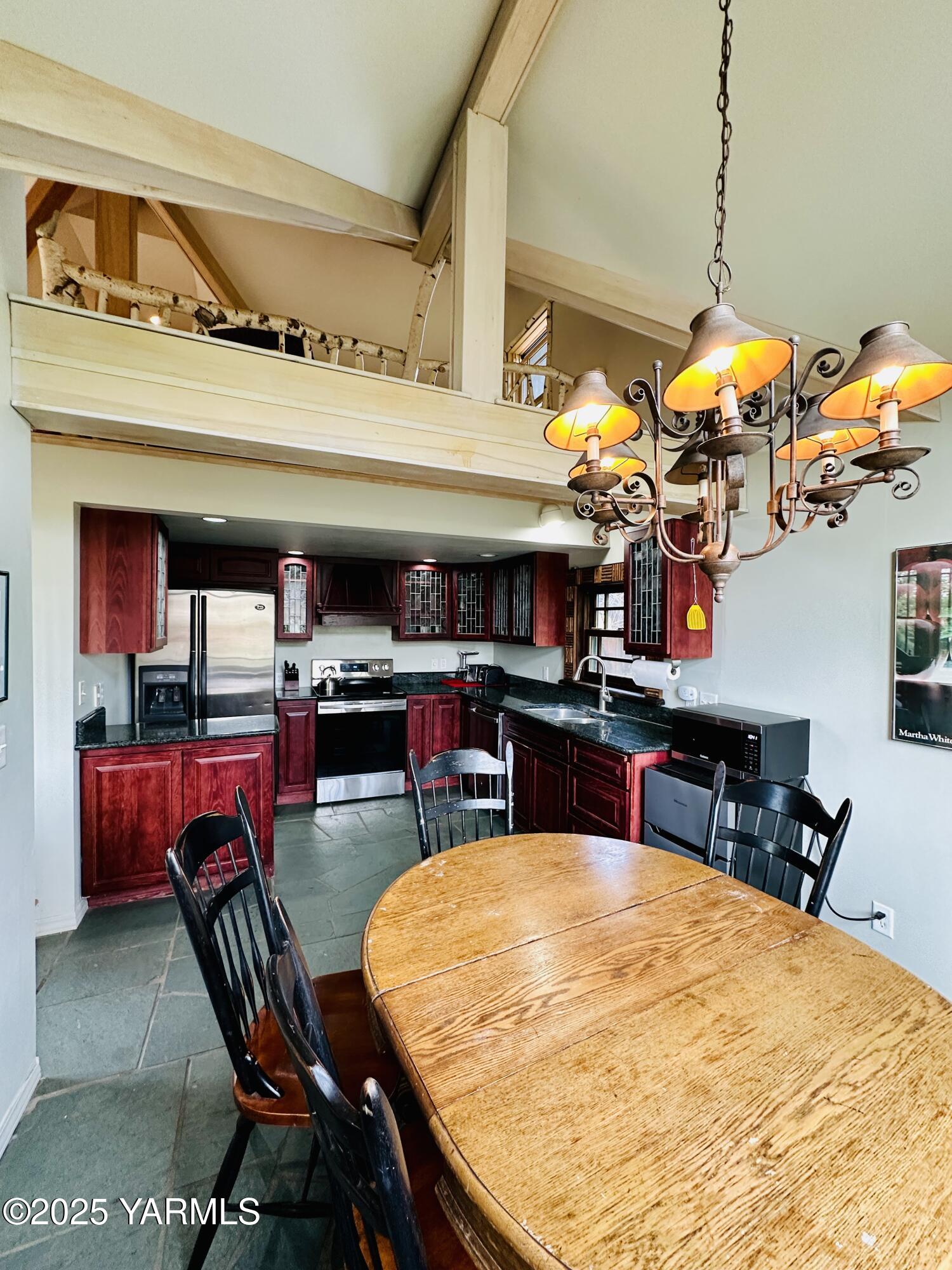 1465 Cook Road Yakima, WA 98908 - Photo 11 of 43 a room with stainless steel appliances kitchen island granite countertop furniture and a dining table