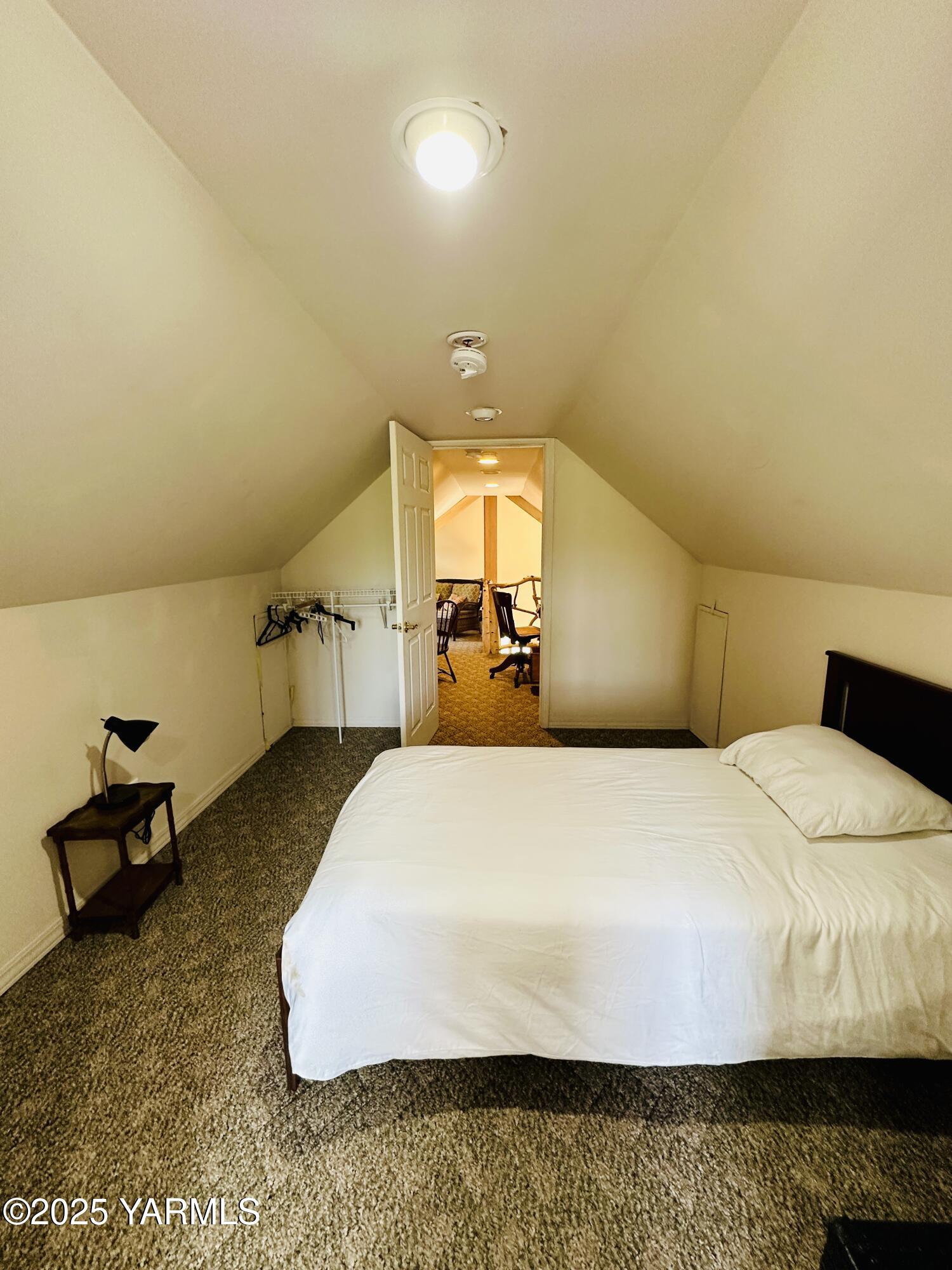 1465 Cook Road Yakima, WA 98908 - Photo 24 of 43 a bedroom with a bed and wooden floor