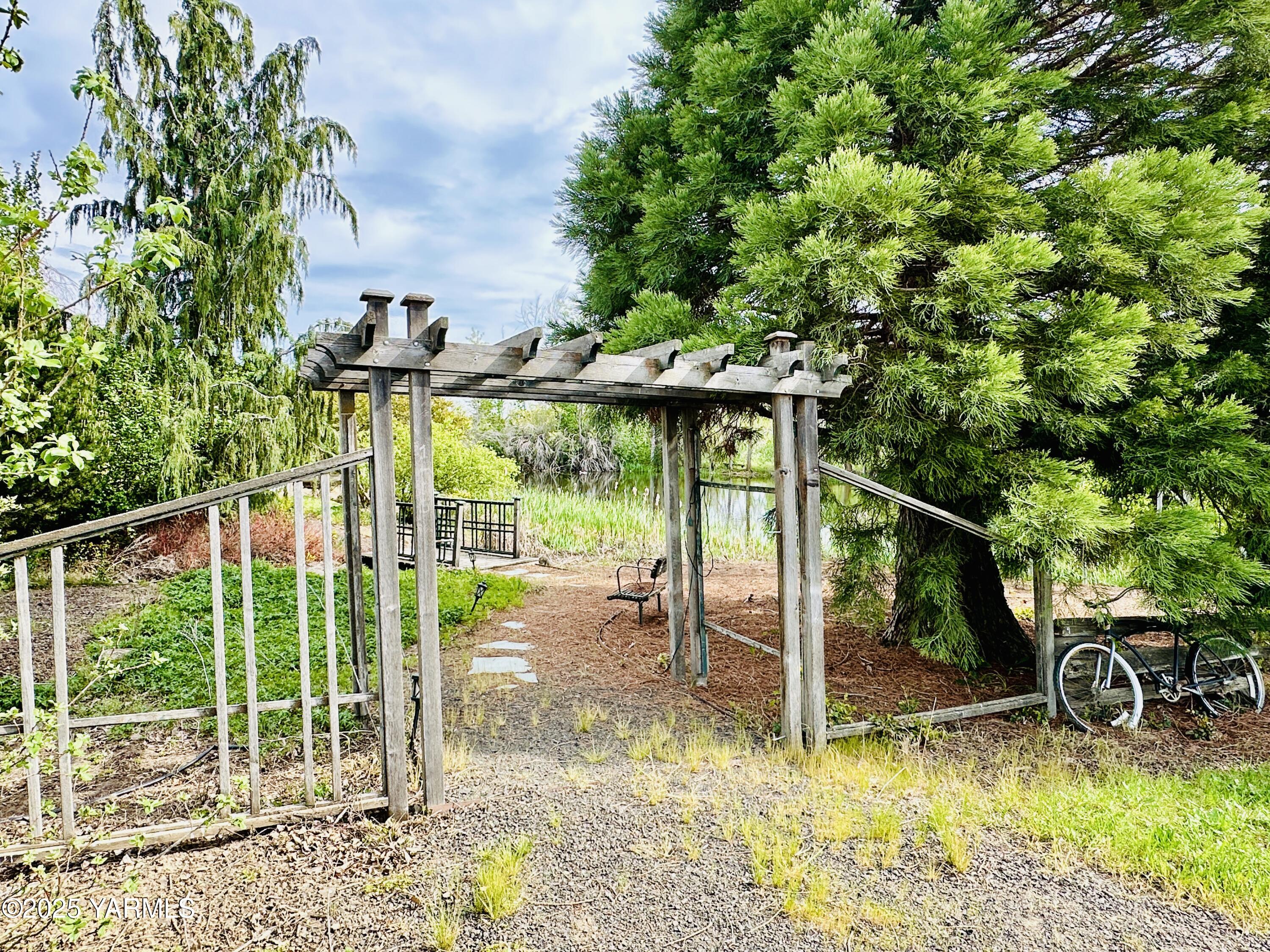 1465 Cook Road Yakima, WA 98908 - Photo 42 of 43 a view of a patio with a table chairs and a floor to ceiling window