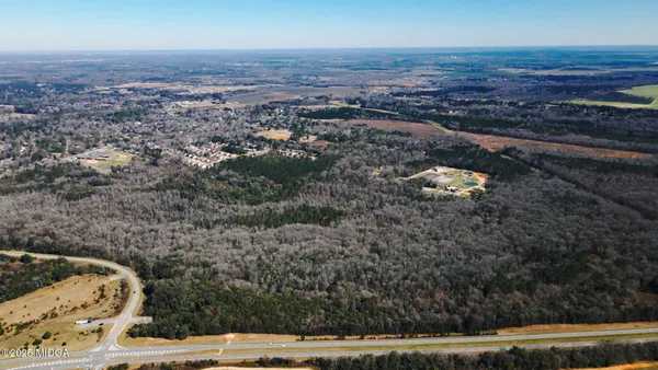 a view of balcony with wooden floor