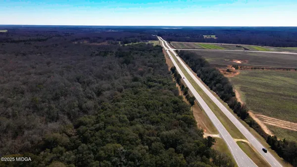 a view of balcony with wooden floor