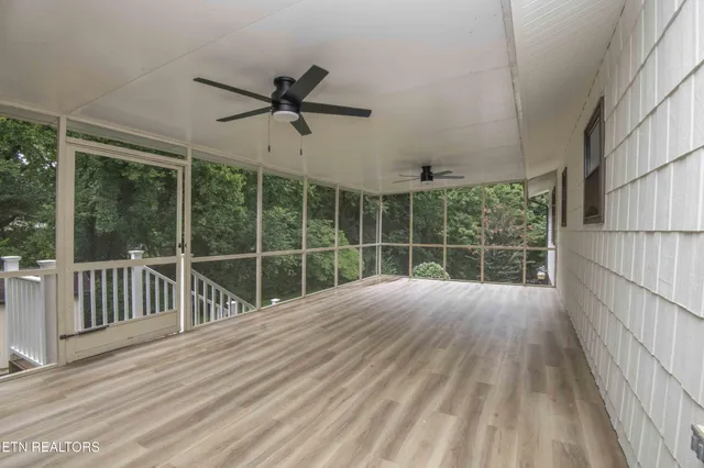 a view of a deck with wooden floor and outer view