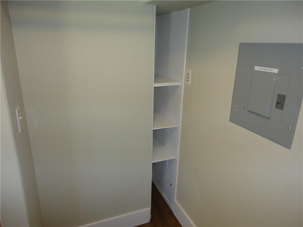 3311 Speedway, Unit D Austin, TX 78705 - Photo 15 of 23 This area features white built-in shelving, a neutral wall color, and white baseboards
