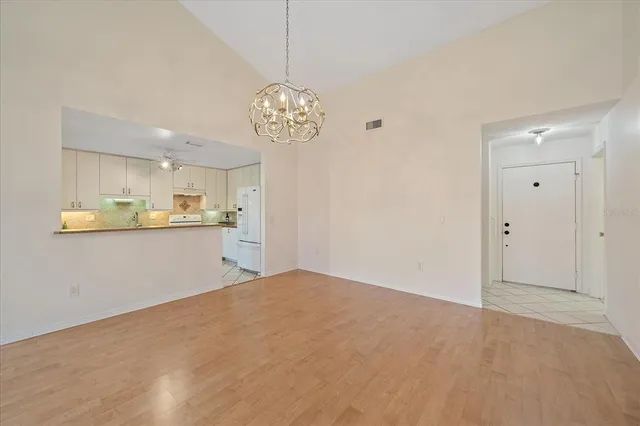 a view of a kitchen and a chandelier