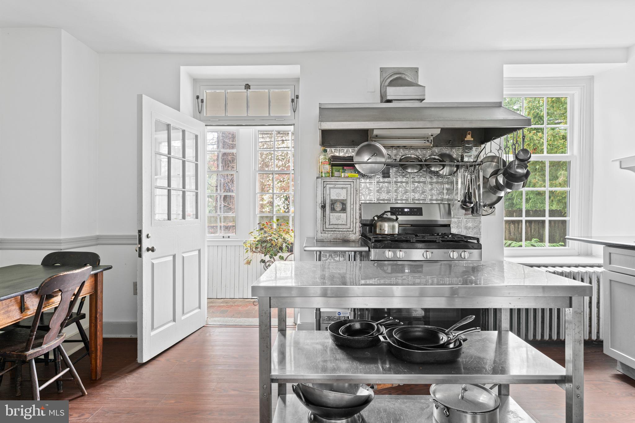 1 East Brookhaven Road Wallingford, PA 19086 - Photo 14 of 57 a kitchen with stainless steel appliances granite countertop a stove and a wooden cabinets