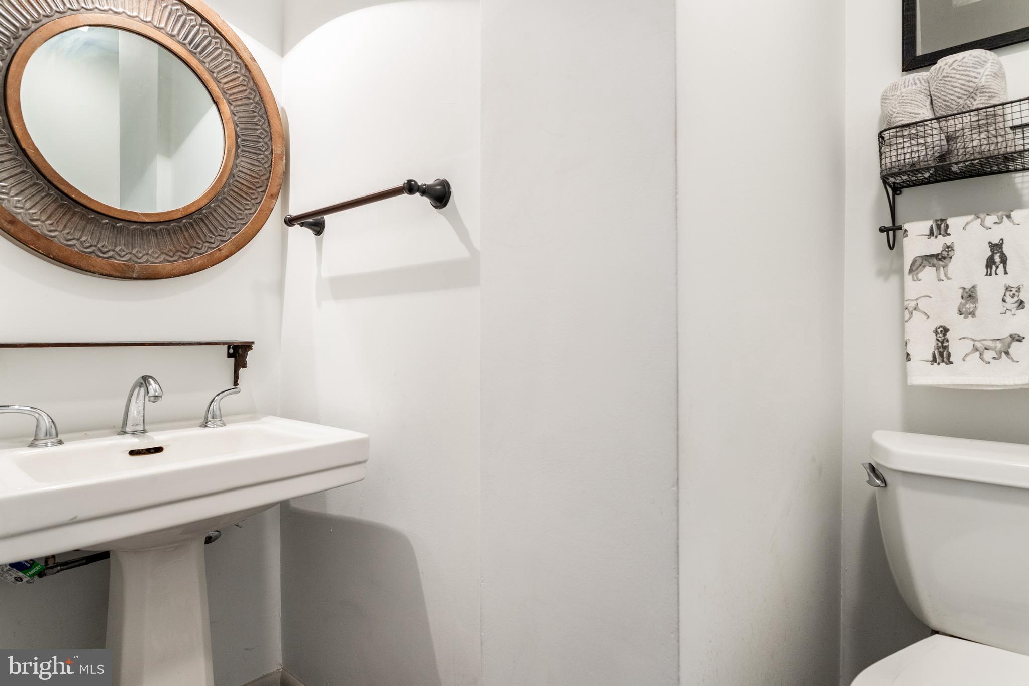 1 East Brookhaven Road Wallingford, PA 19086 - Photo 19 of 57 a bathroom with a sink and a mirror
