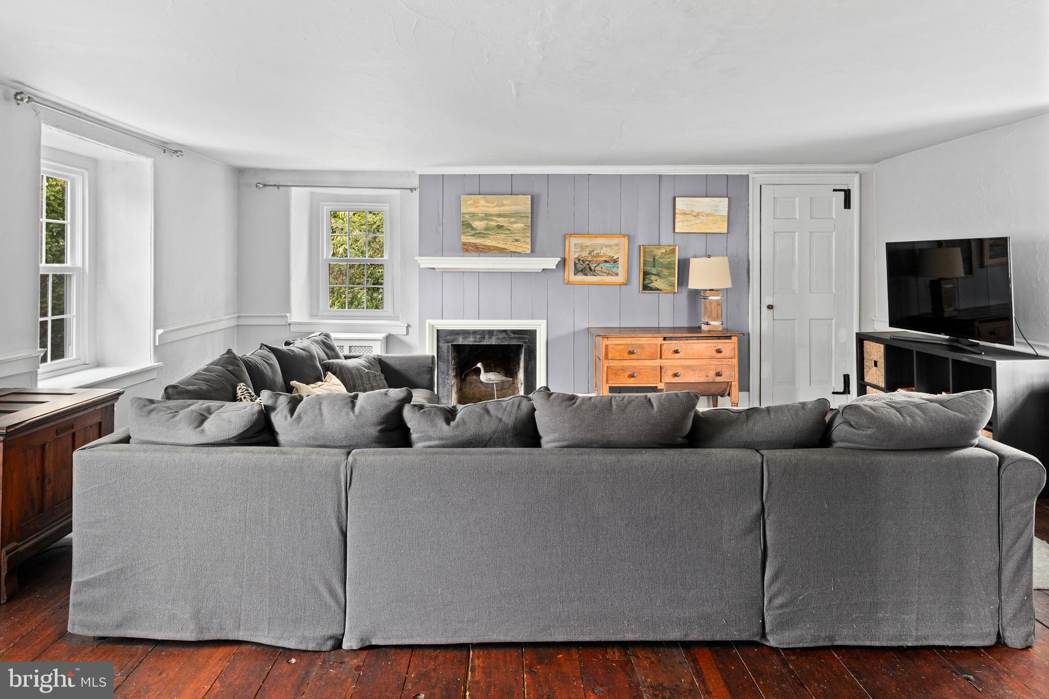 1 East Brookhaven Road Wallingford, PA 19086 - Photo 26 of 57 a living room with furniture and a flat screen tv