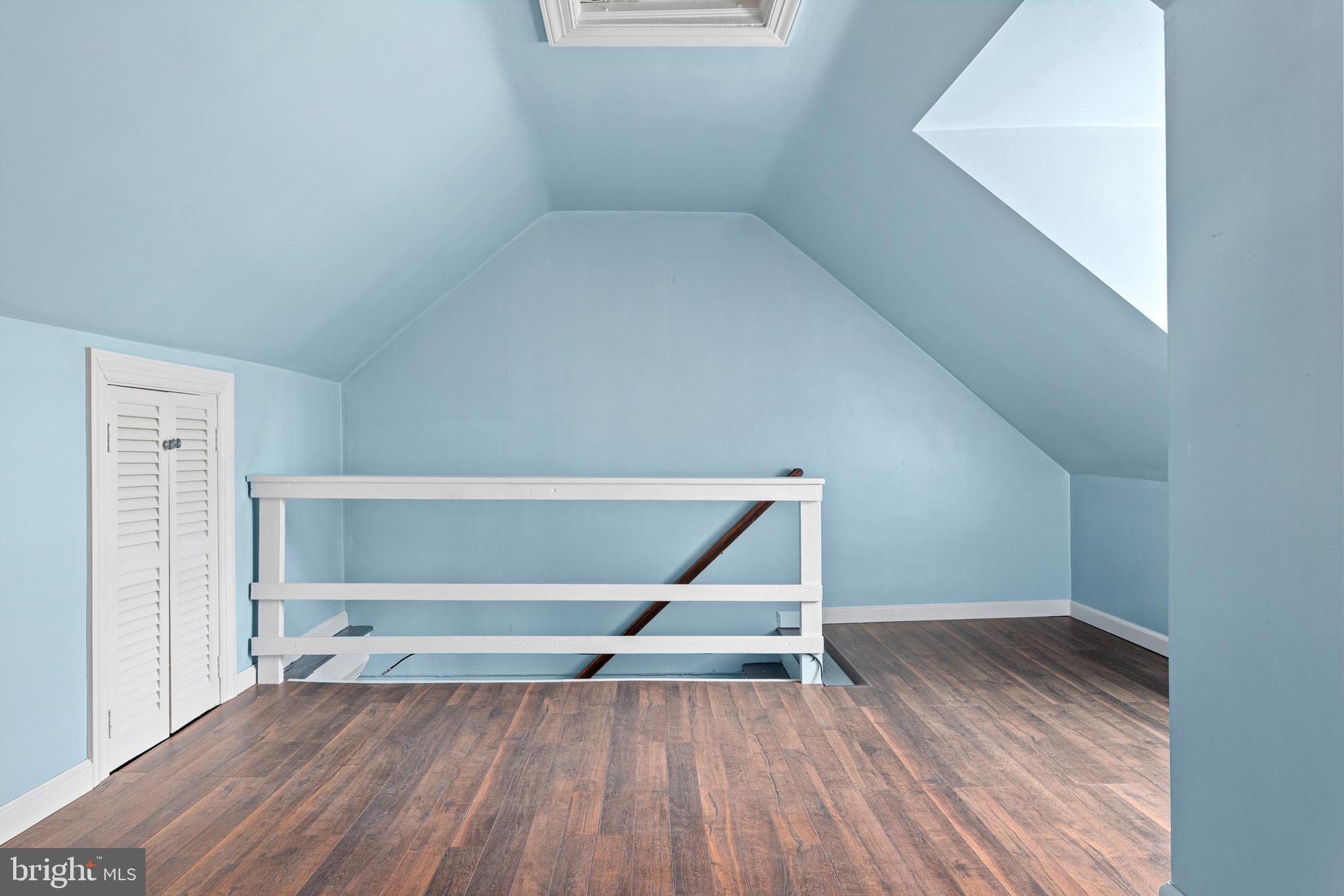 1 East Brookhaven Road Wallingford, PA 19086 - Photo 35 of 57 a view of an empty room with wooden floor and a window