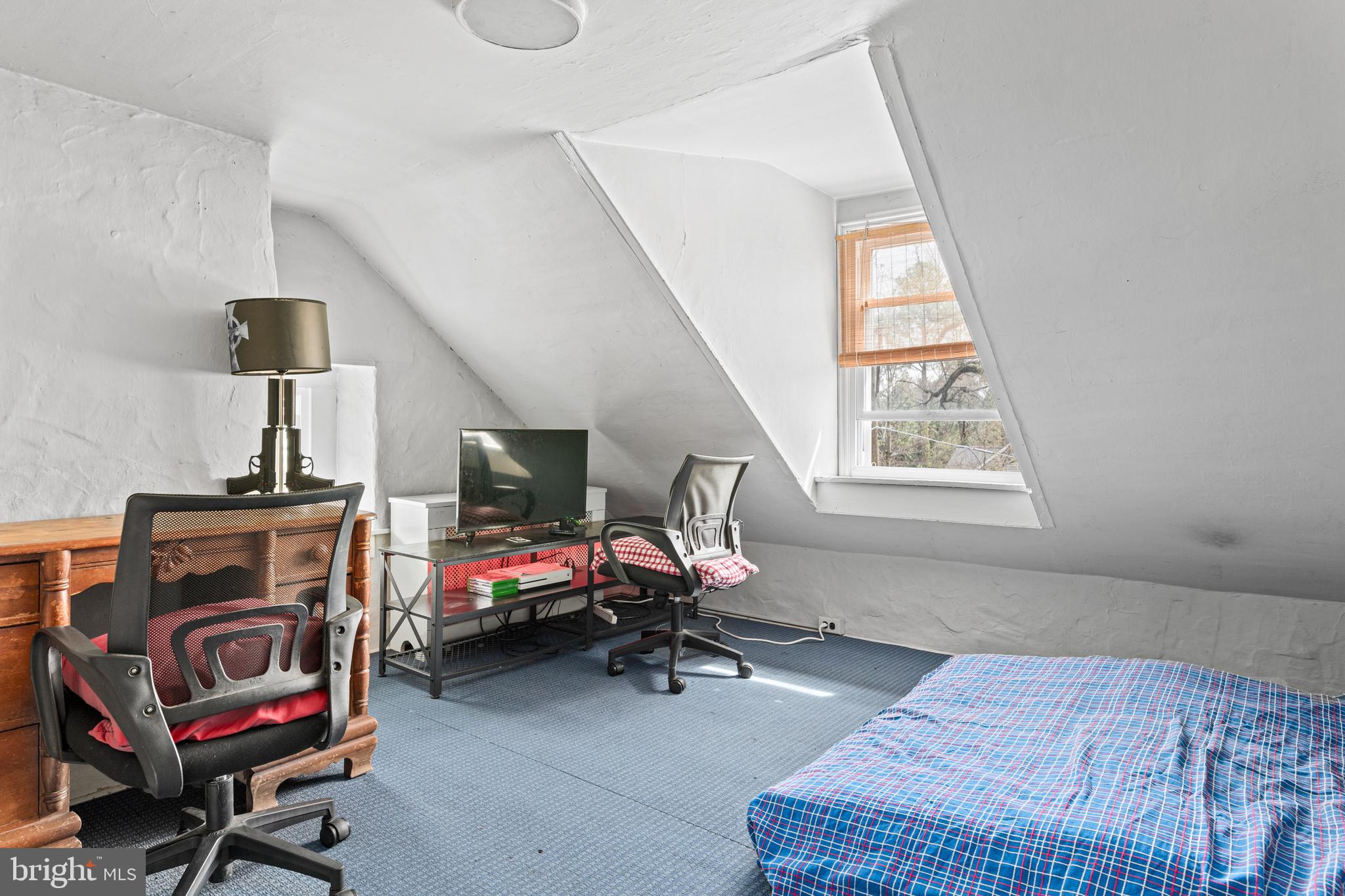 1 East Brookhaven Road Wallingford, PA 19086 - Photo 39 of 57 a living room with furniture a flat screen tv and a window