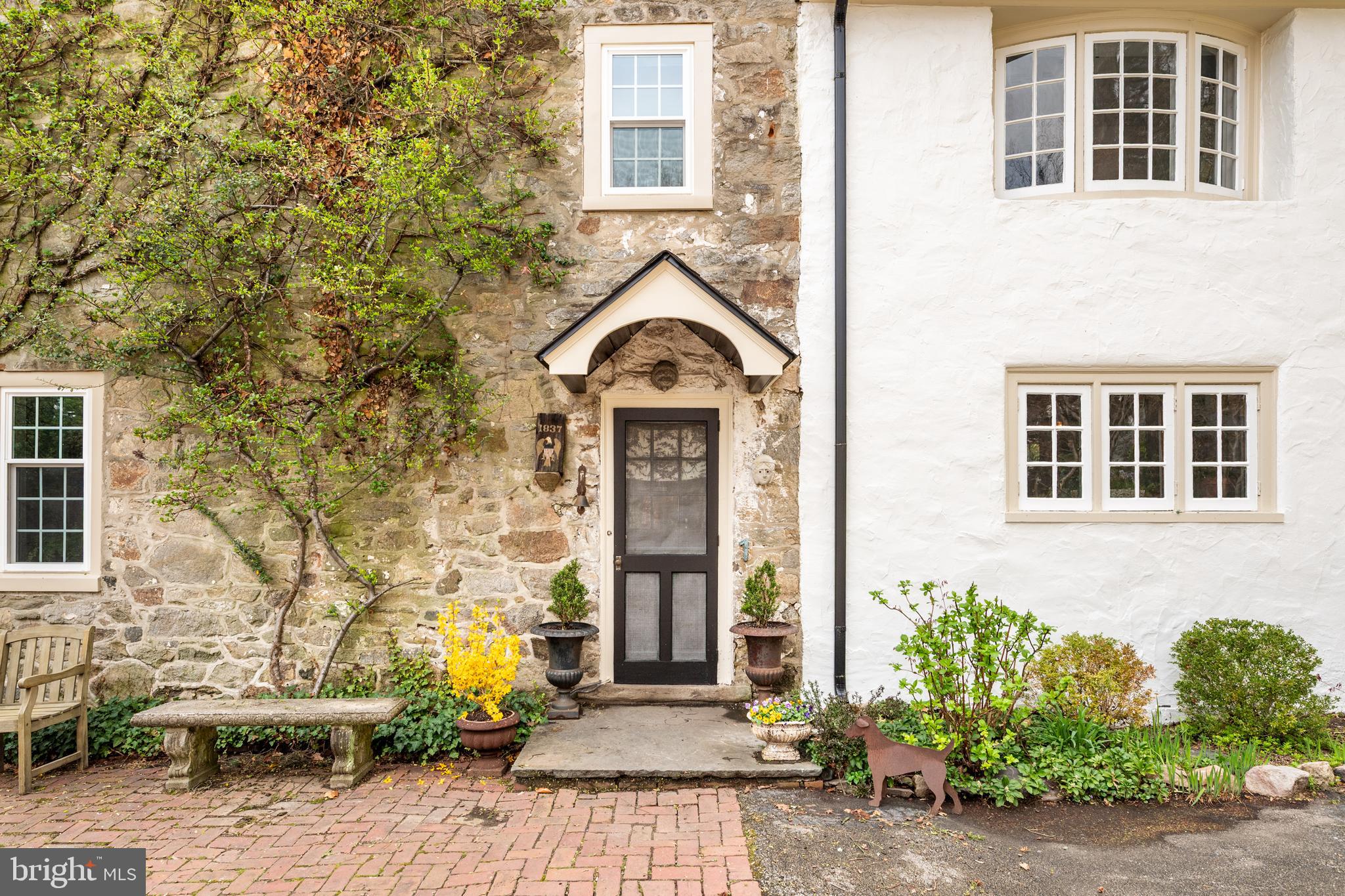 1 East Brookhaven Road Wallingford, PA 19086 - Photo 42 of 57 a view of a brick house with many windows