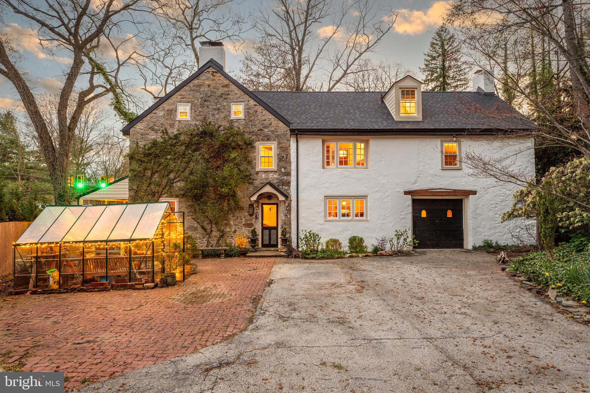 1 East Brookhaven Road Wallingford, PA 19086 - Photo 51 of 57 a front view of a house with a yard and garage