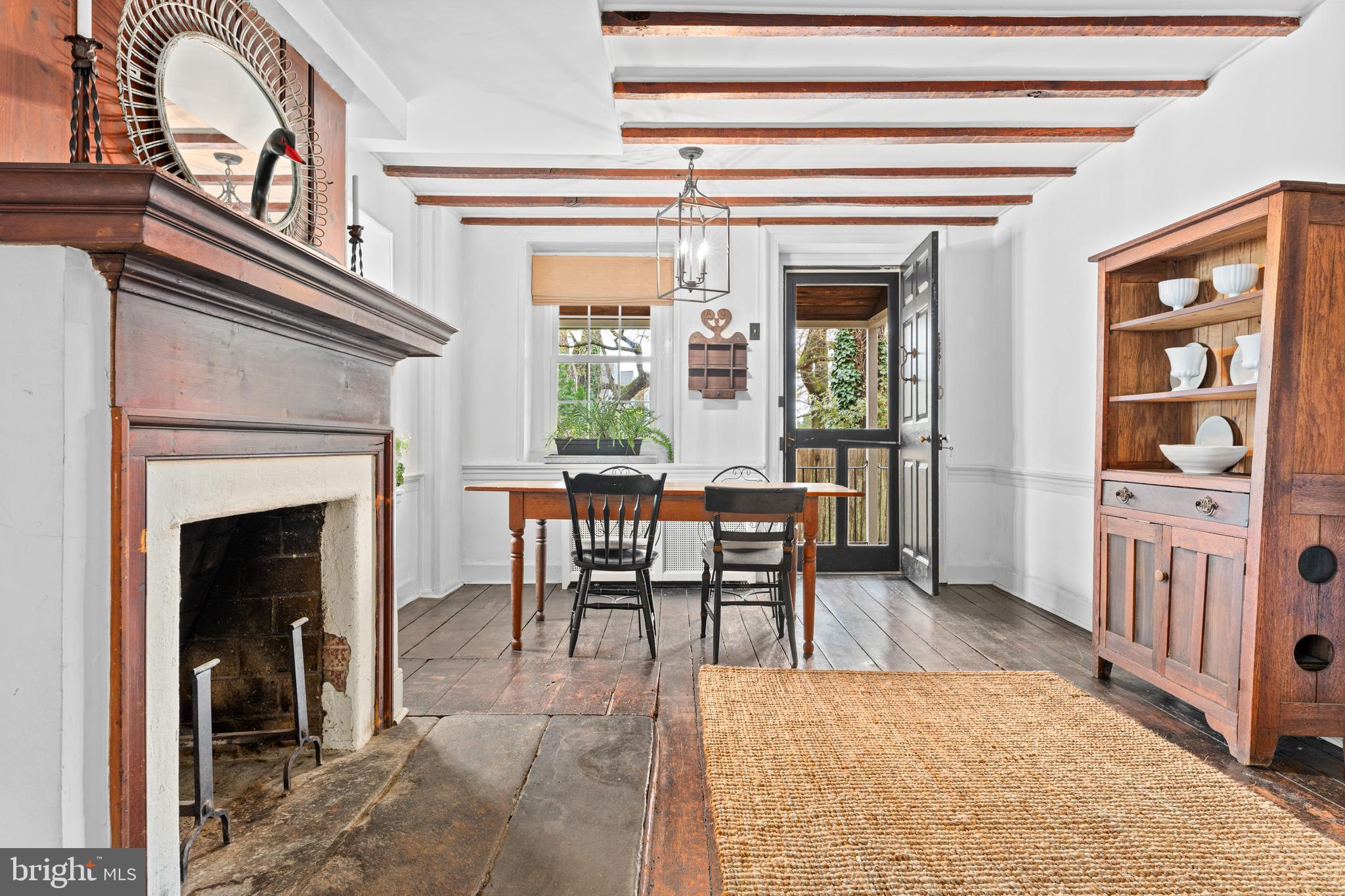 1 East Brookhaven Road Wallingford, PA 19086 - Photo 6 of 57 a view of a livingroom with furniture and a fireplace
