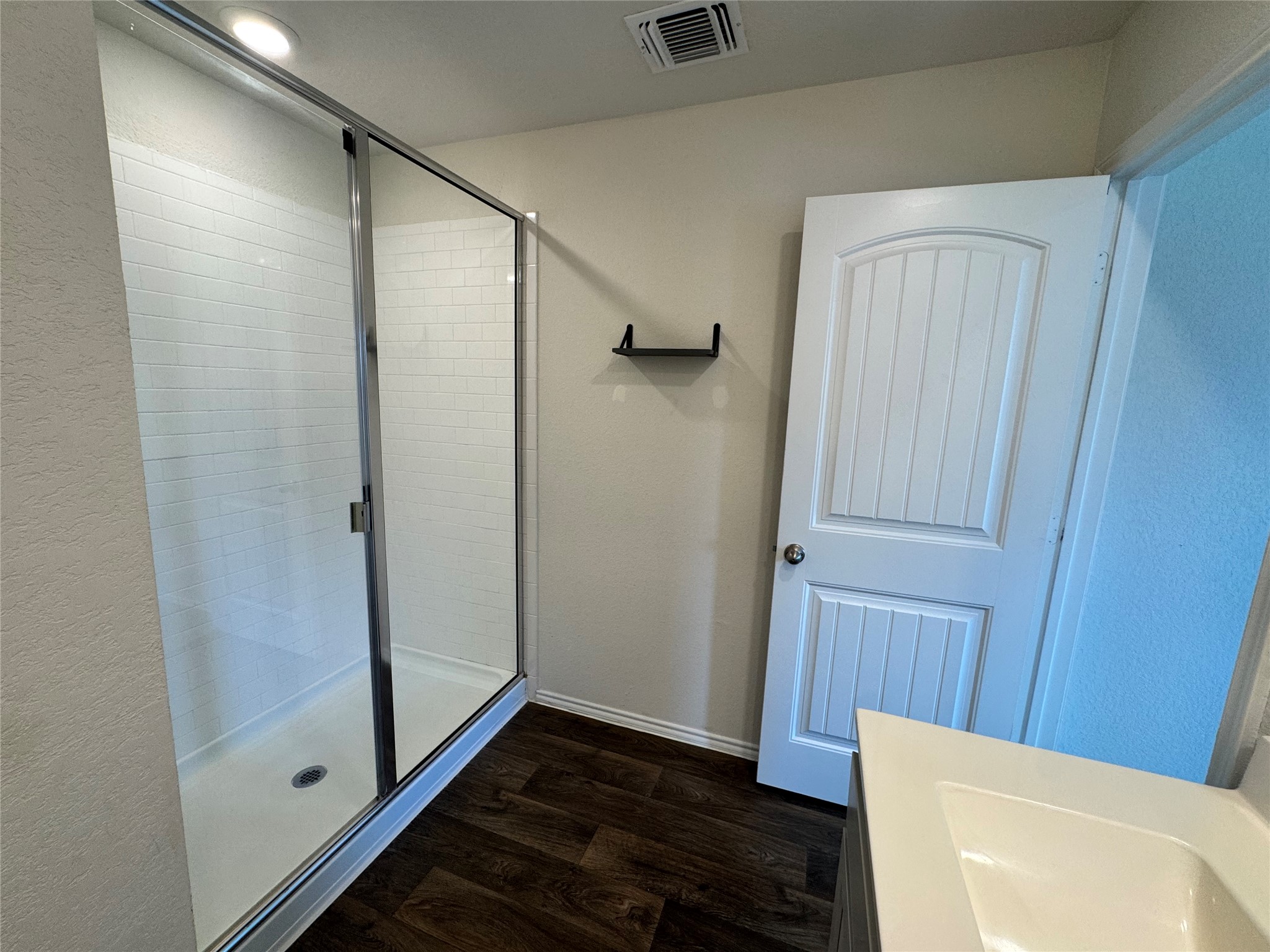 11820 Rush Lane Elgin, TX 78621 - Photo 7 of 31 A well-appointed bathroom with a spacious glass-enclosed shower.