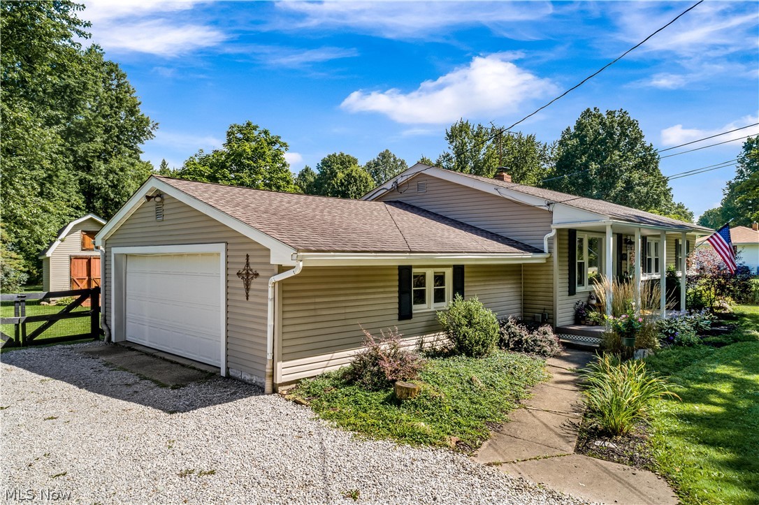 3245 Brenner Road Barberton, OH 44203 - Photo 2 of 30 Side load garage and beautifully landscaped walkway