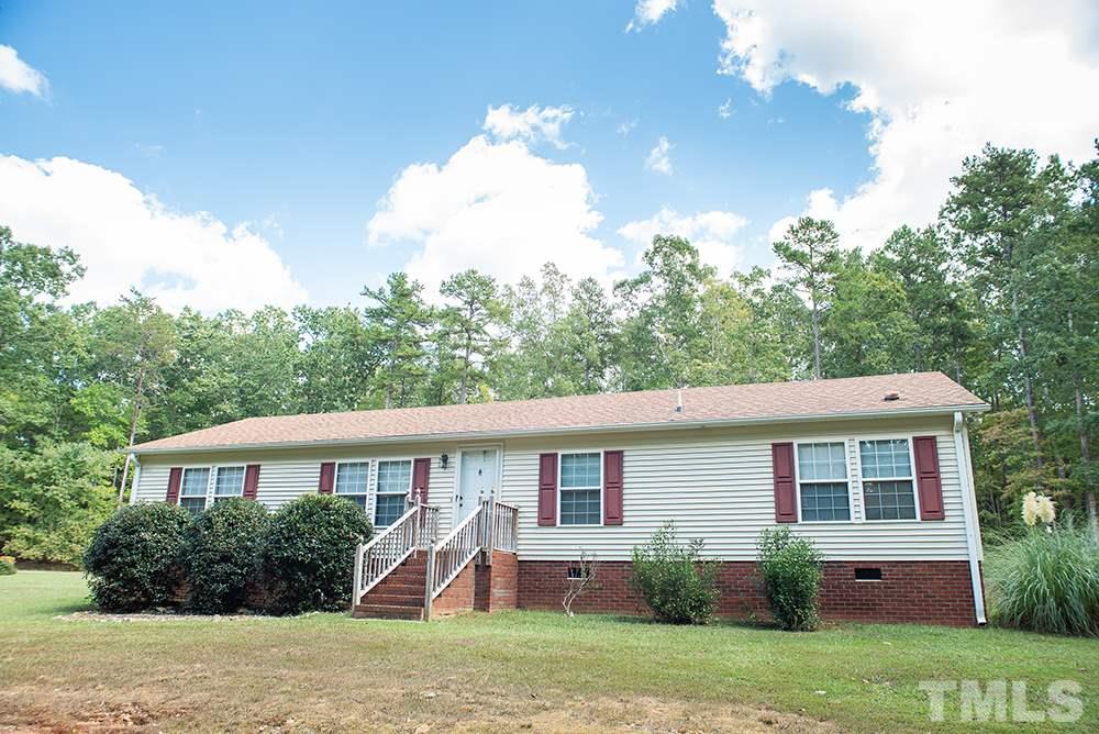 1579 Julian Oakley Road Rougemont, NC 27572 - Photo 1 of 15 a view of a house with a yard