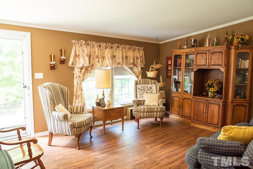 1579 Julian Oakley Road Rougemont, NC 27572 - Photo 2 of 15 a living room with furniture and a fireplace