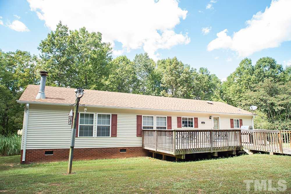 1579 Julian Oakley Road Rougemont, NC 27572 - Photo 13 of 15 a view of a house with a yard and a yard