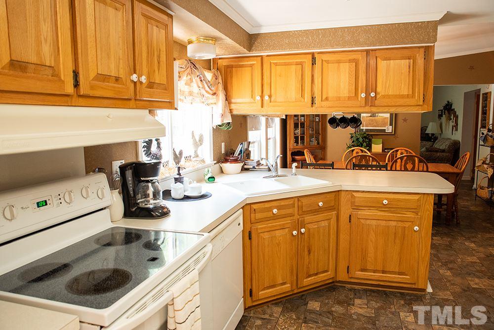 1579 Julian Oakley Road Rougemont, NC 27572 - Photo 3 of 15 a kitchen with a sink stove and cabinets