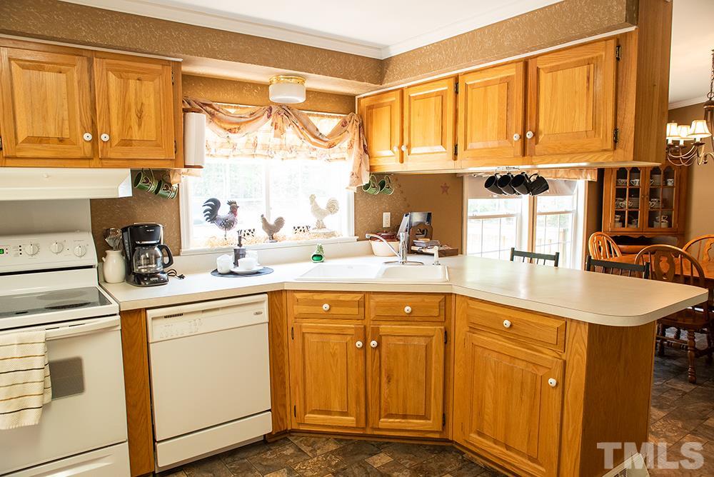 1579 Julian Oakley Road Rougemont, NC 27572 - Photo 4 of 15 a kitchen with stainless steel appliances granite countertop a sink and a cabinets