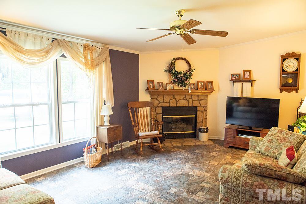 1579 Julian Oakley Road Rougemont, NC 27572 - Photo 6 of 15 a living room with furniture a flat screen tv and a window