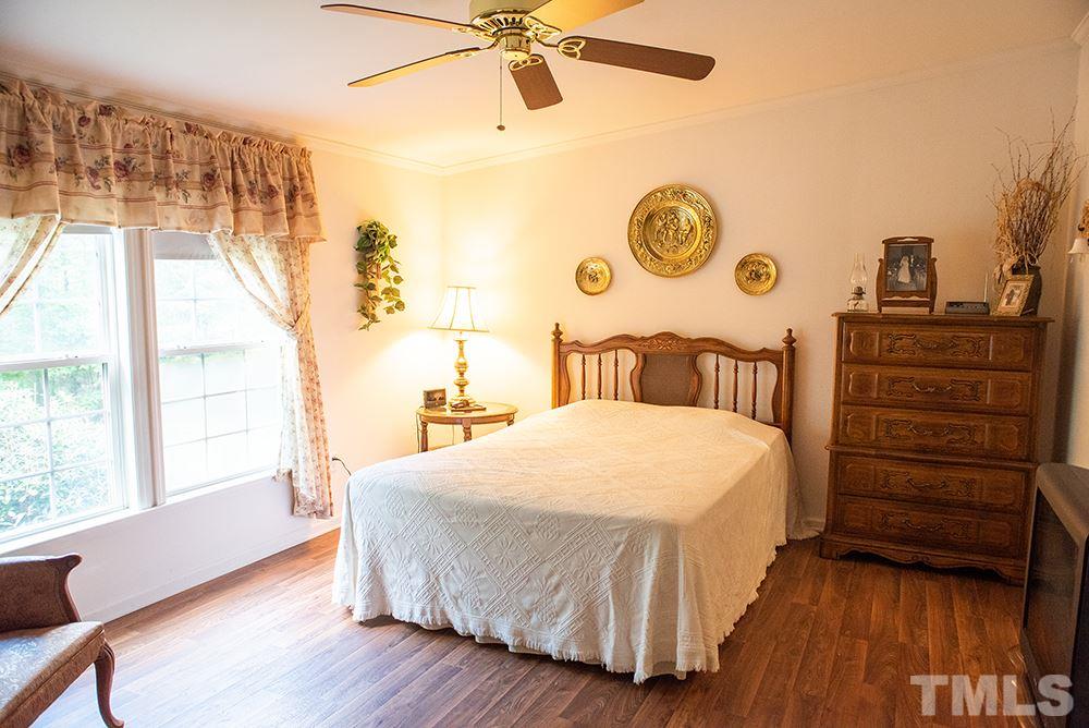 1579 Julian Oakley Road Rougemont, NC 27572 - Photo 7 of 15 a bedroom with a bed and a window