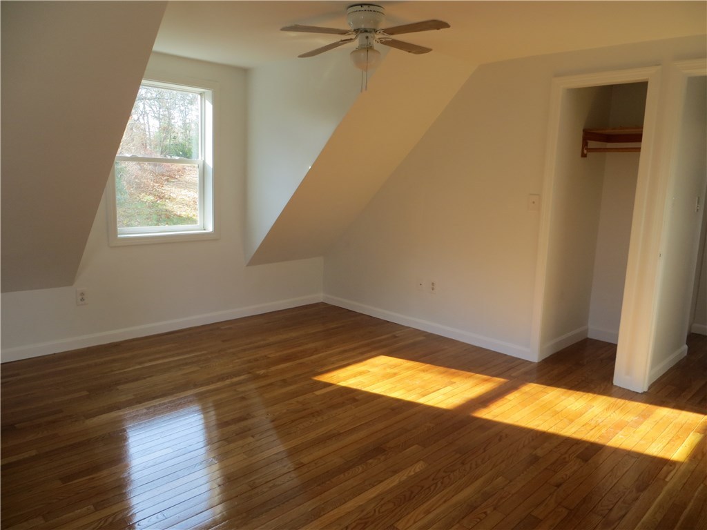 83 Columbia Heights Road Charlestown, RI 02813 - Photo 10 of 26 Second floor bedroom looking outside and towards hallway.