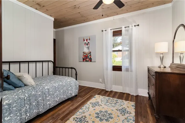 a large bed sitting in a bedroom next to a bathroom