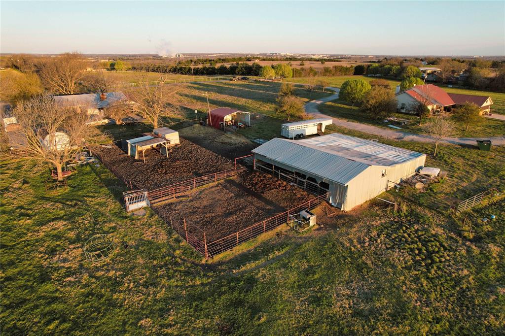 992 Bennett Road Howe, TX 75459 - Photo 22 of 26 an outdoor living room with patio furniture and a lake view