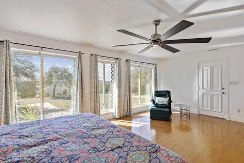 a bathroom with a sink vanity granite toilet and shower