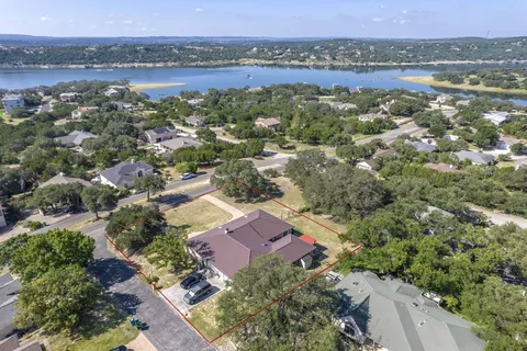 an aerial view of a house with a lake view