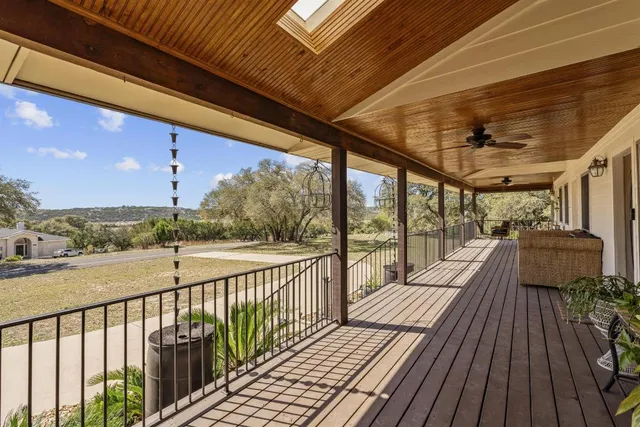 a view of a balcony with wooden floor